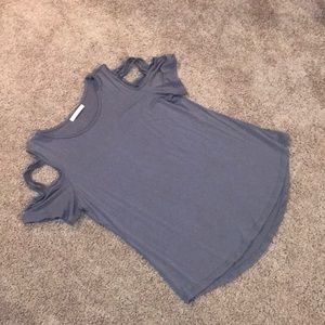 Top with criss cross sleeves
